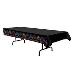 Day Of the Dead Table Cover - This Day of the Dead Table cover is a necessity for your buffet or snack table. Its jet black color makes the colorful multi-colored skulls and flowers along the sides pop with color. 
